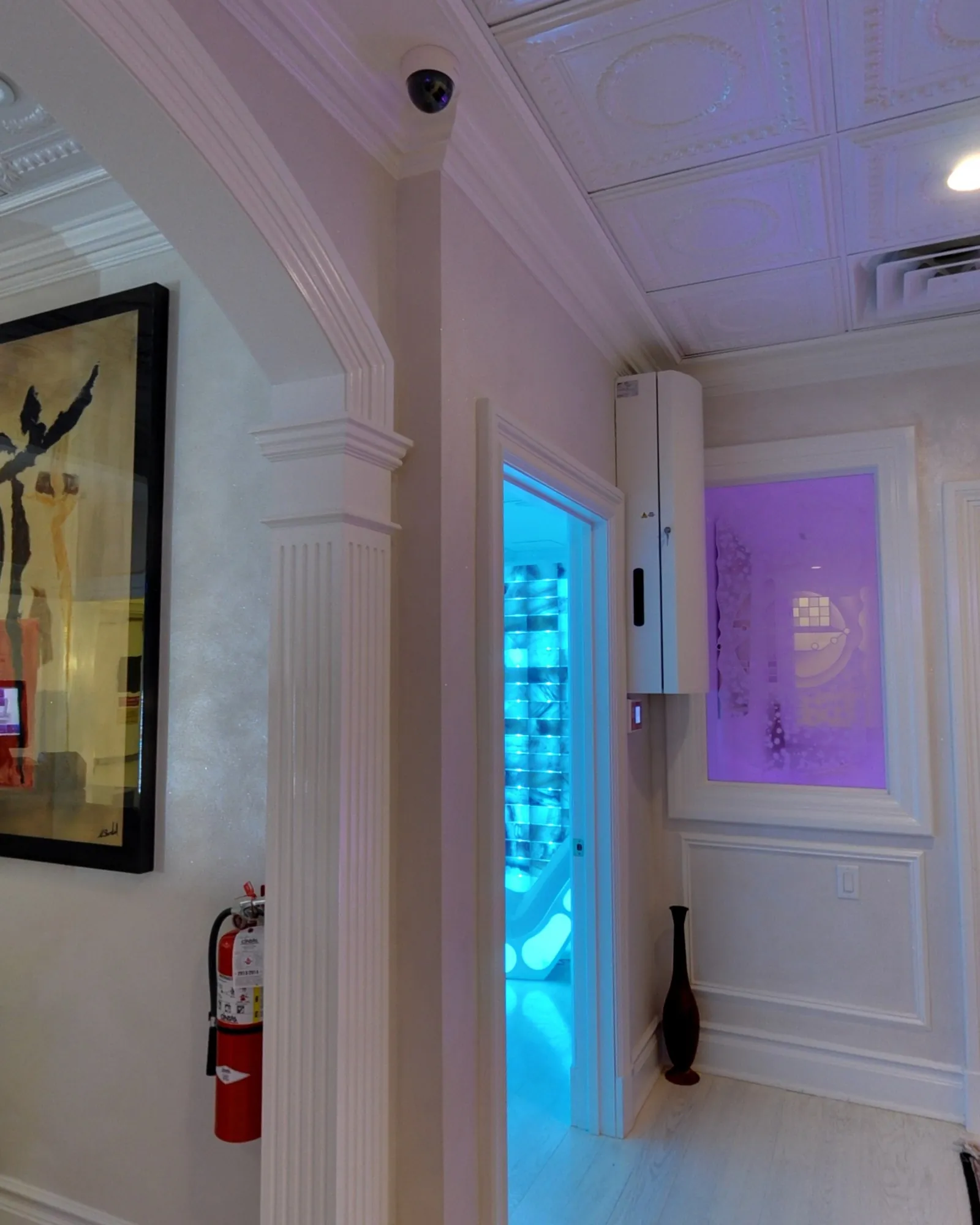 A blue-lit doorway off the relaxation lounge.