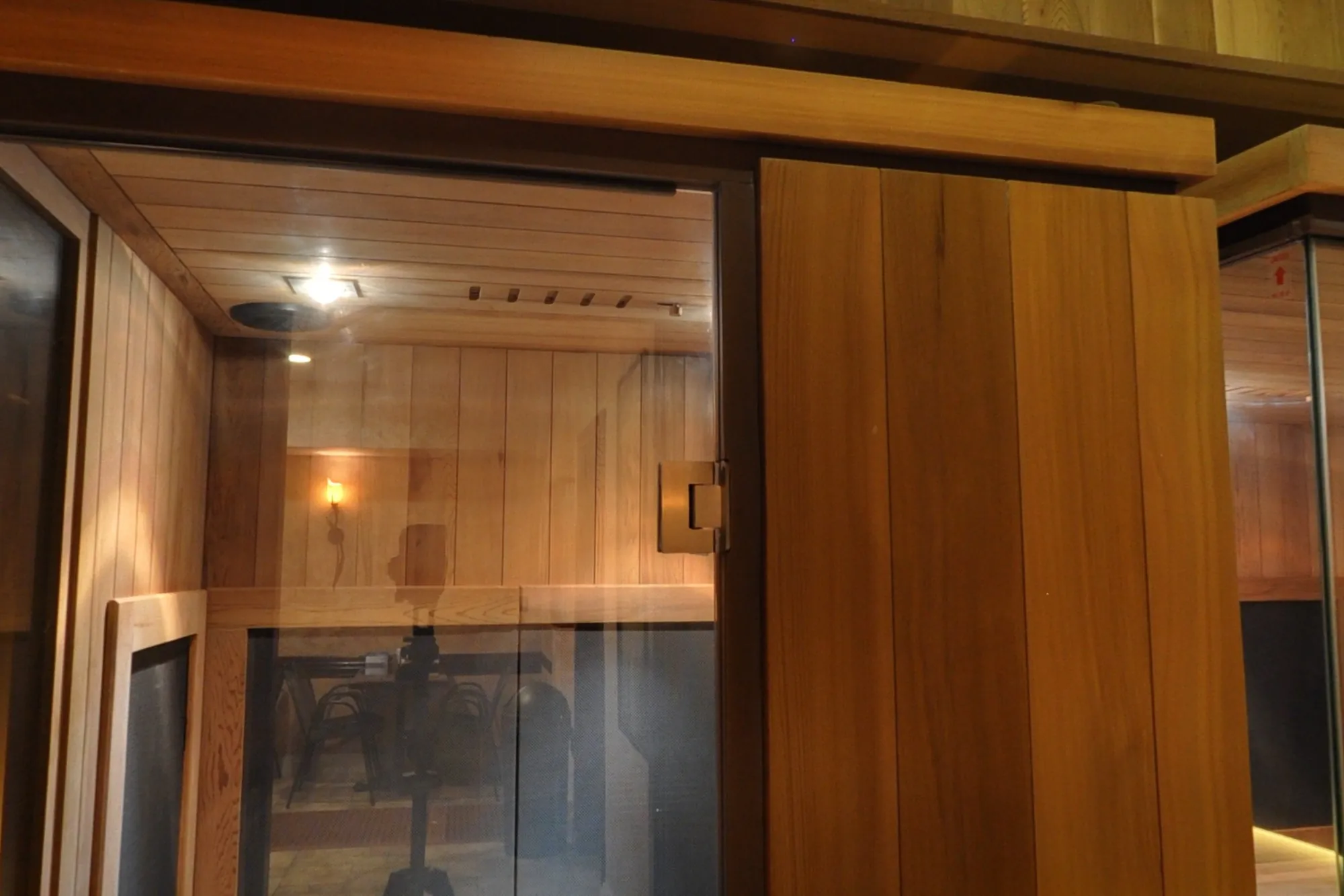 Two glass-fronted cedar infrared cabins in BRC's cedar-panelled infrared room.