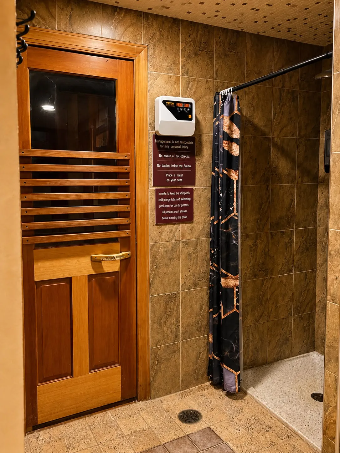 The sauna door with its thermometer and the aroma room's curtain.